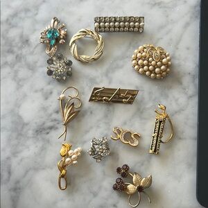 Gold and Silver Brooch Collection with Intricate Designs